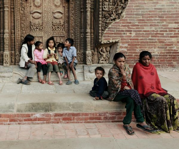 A diverse group of people of different ages sitting calmly.